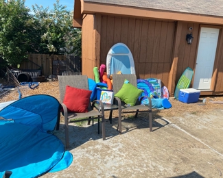 Pool toys and chairs with table 
