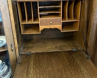 Drop-Down Desk and Cubby Holes with Drawer.  Hinges are tight and hold desk stable.