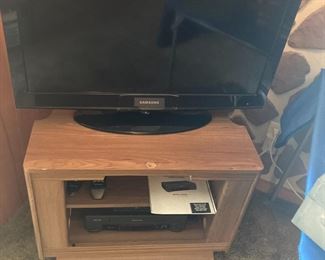 32" Samsung TV with remote; TV stand; Sylvania DVD Player