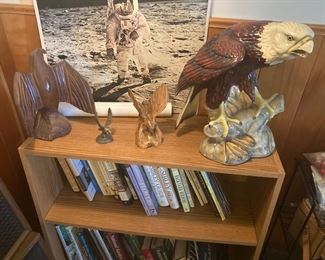 Blonde Laminate Book Shelf; Hand Carved Eagle; Pewter Eagle; Wood Carved Eagle; Large Plaster Hand Painted Eagle; Poster of Astronaut on Moon; Assorted Birding Books
