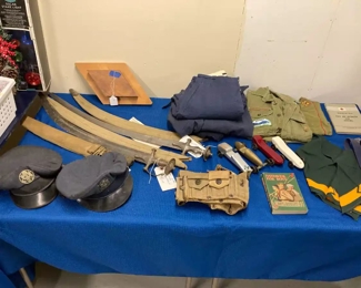 Airforce Crusher Hats; Boy Scout Clothing and Memorabilia; WWII Era Wool Air Force Pants; Machete with Canvas Cover; WWII US Military Ammunition Cartridge Belt (dated 1942); Sikh (Indo-Persian) Swords / Sabres with Metal-Tipped Canvas Covers
