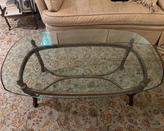 Glass topped coffee table 50"W x 30"D x 19"H 