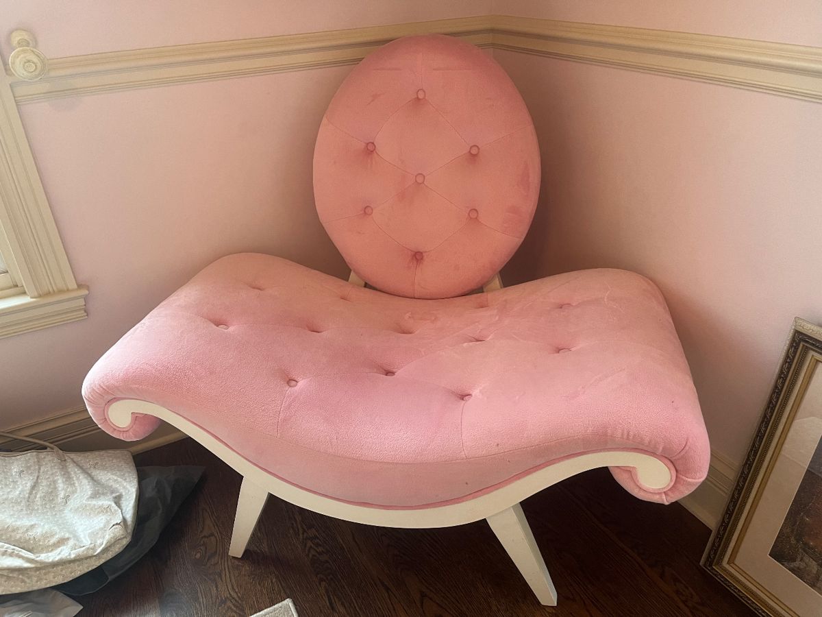 Pink upholstered chair 45"W x 41"H with a seat height of 17"