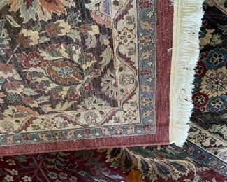 Backside of the 100% wool area rug and fringe details