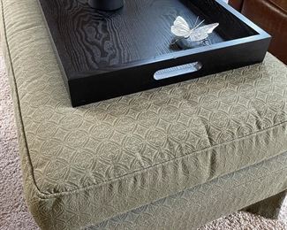 upholstered ottoman and black tray