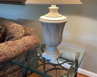 Metal side table with glass top and table lamp with ivory linen shade