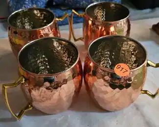 FOUR COPPER MUGS
