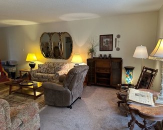 Another view of the living room showing some antique furniture pieces
