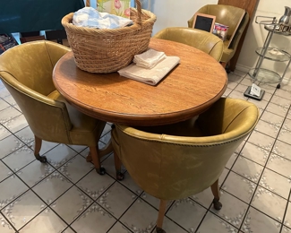 Retro round table with four greenish-goldish vinyl swivel chairs - includes an extra leaf to fit all four properly