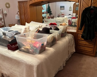 Master Bedroom King Bed Surround. Lots of women's hats