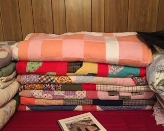 large sectional of handmade quilts. several different designs & patterns