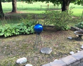 cobalt blue glazing ball on wrought iron stand