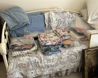 Daybed and linens.