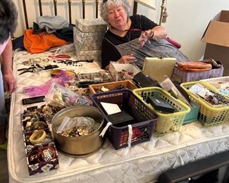 Barbara James in her element and lounging on a queen size brass bed!