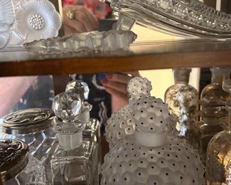 Lalique, Stueben, crystal and pressed glass perfume bottles.