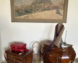 We have a collection of mighty miniature chests.  The one to the right is an early 19th century bombe chest well worth the price of $450.  Don't forget the oil on canvas landscape by Siegrfried Hahn at $1000.  It glows.