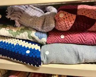 Hand crocheted blankets in the garage.