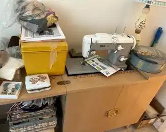 We have a Pfaff sewing cabinet machine with a huge assortment of notions.