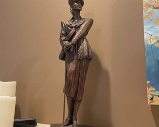 . . . female golf statue
