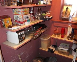 Walk in pantry is full of items.