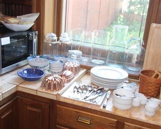 Kitchen is full of quality dishware.