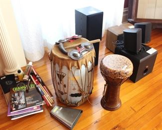 Variety of musical instruments and shelf speakers.