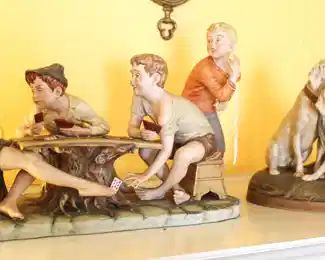 Statue on left "Cheaters" by Pucci. 18" W x 11" H. Number 4058.                                                                                          On right, Royal Ducks, Bohemia Number 1765.          11" W x 9" H.