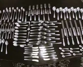 Beautiful repousse sterling flatware set is mostly by Stieff Silver Company, some of the specialty pieces are by S. Kirk & Son.  We have 131 pieces.                                                      NOTE:  STERLING ITEMS ARE NOT LEFT UNATTENDED OR IN THE HOUSE OVERNIGHT.