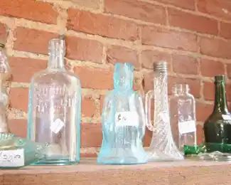 Antique glass figural bottles.