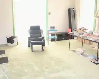 Far right corner, Ikea Besta Burs wall hanging cabinet, 11" D x 11" W x 71" L.  On floor, black cabinet with drawers. 43 3/4" W x 16" D x 16" H. Ikea cowhide Pouffe. Black & White fisheye noir area rug. 120 cm. x 190 cm.