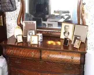 Antique tiger oak dresser with mirror.                                   
48" W x 22 1/2" D x 73" H.