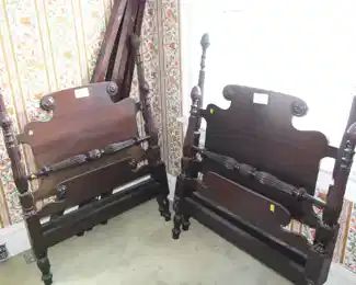 Pair of twin beds with carved posts.