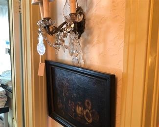 one of a pair of sconces and one of a pair of paintings