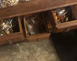 many drawers full of lamp finials