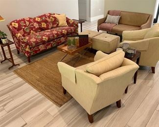 The side table, center tray table, rug, leather sofa and 2 side chairs are sold.