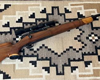 Custom Bolt Action Rifle with Scope 	Total Length: 44.35in Long	
