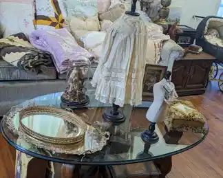 Vintage glass top table, doll trunks, Victorian photo album/music box.