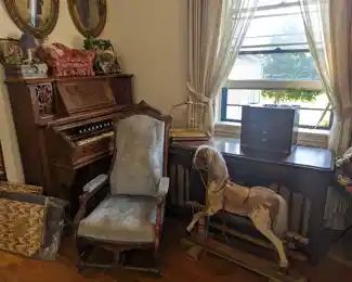 Victorian pump organ, 1960's console, Victorian rocking horse.