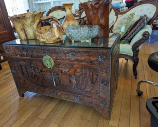 Carved camphor wood chest with glass top.