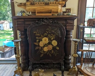 1860's Carved firescreen with painted flowers. Large handmade vintage tramp art model boat labeled USS Constitution. Large brass candlesticks, door stops.