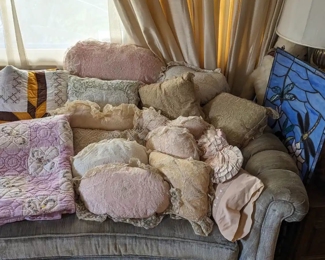 Antique lace pillows. Stained glass windows.