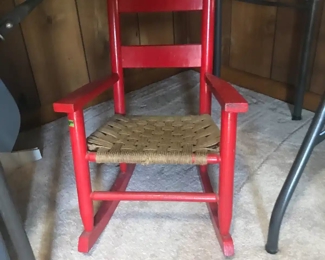 Child's rocking chair, seat is of woven twine and is in good condition.