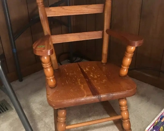 Stout child's rocking chair, needs refinishing or painting but is otherwise in very good condition.