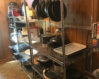 Kitchen gadgets and small appliances, including large crock pots, infrared indoor grill, food processor, deep fat fryer; also have some cast iron skillets.