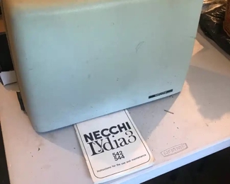 "portable"(It is heavy!) sewing machine. Untested.