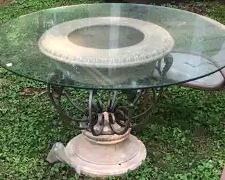 Concrete wrought iron table with glass top