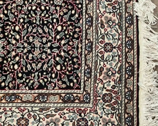 Black and ivory wool rug 4’10” x 7’