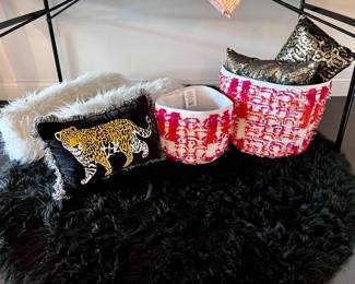 Throw pillows, faux fur rug and baskets