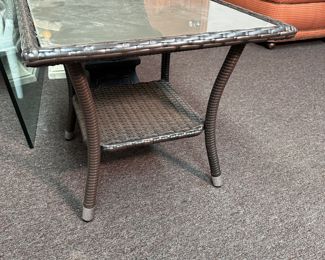 Woven vinyl patio side table with glass top, some wear, 18"H x 18"W