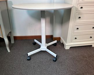 Adjustable-height (28"- 44"H) bistro table with metal base on casters, laminate top, 30"W